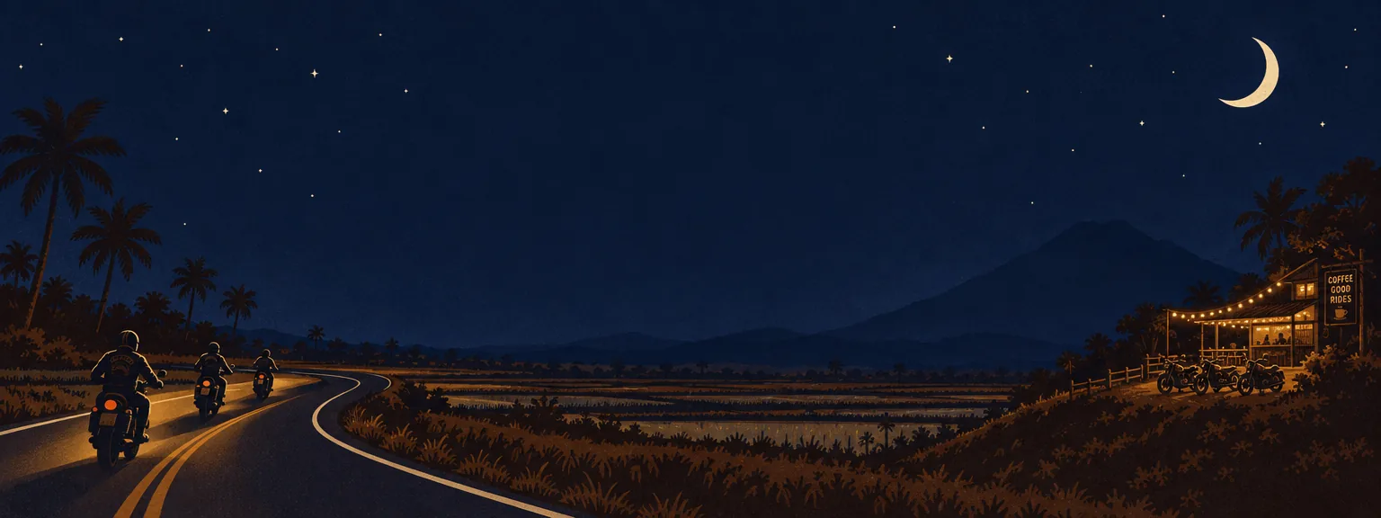 Riders on a winding night road toward Mt. Arayat, with a lit roadside café ahead